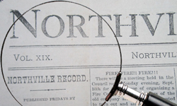 Image of a magnifying glass over the newspaper. Click here to search the Newspaper Archives!